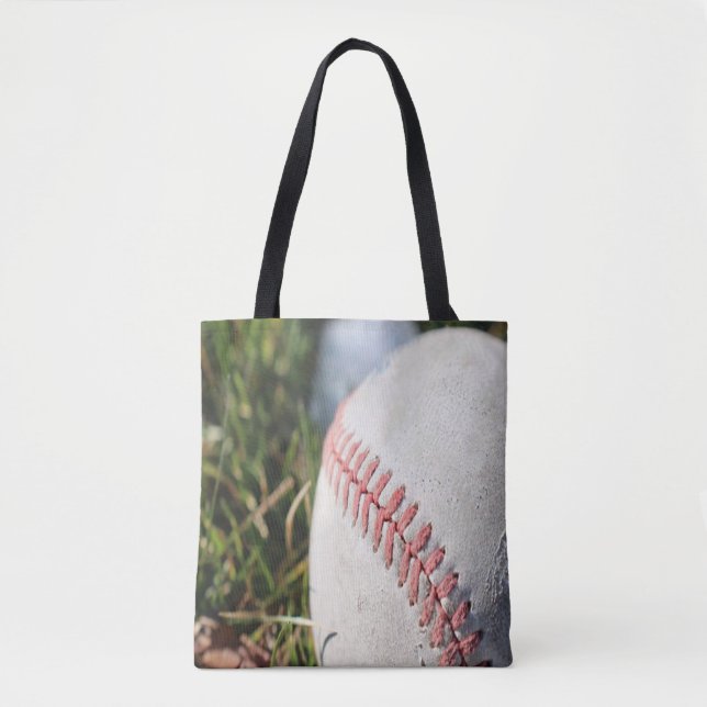 Close Up of a Baseball in Grass Tote Bag (Front)