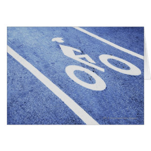Close-up of a bicycle sign on the road