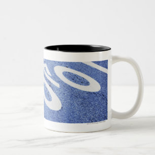Close-up of a bicycle sign on the road Two-Tone coffee mug