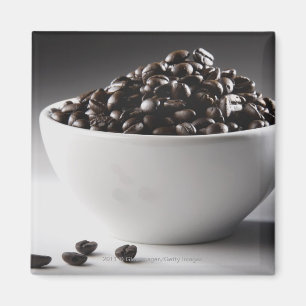 Close-up of a bowl full of coffee beans magnet