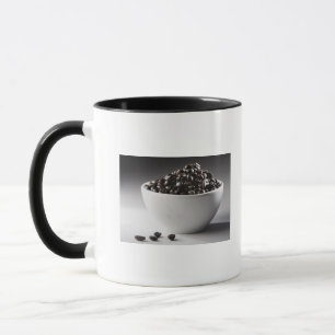 Close-up of a bowl full of coffee beans mug