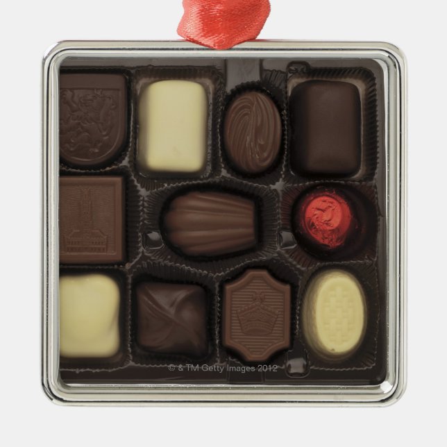 close-up of a box of assorted chocolates metal ornament (Front)