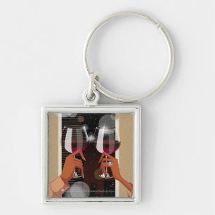 Close-up of a couple's toasting with wine glasses key ring