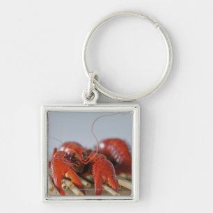 Close-up of a crab on sticks key ring