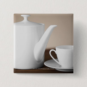 Close-up of a cup and a saucer with a tea kettle 15 cm square badge
