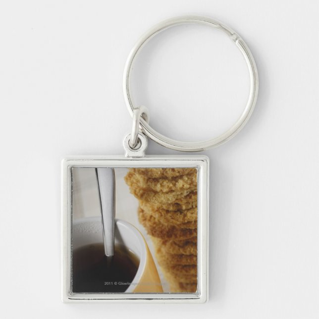 Close-up of a cup of coffee with cookies key ring (Front)