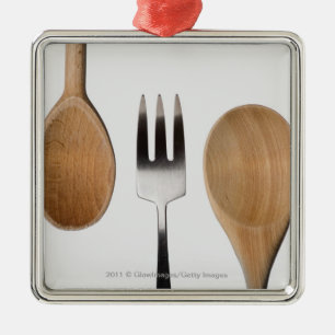 Close-up of a fork with a wooden spoon metal tree decoration