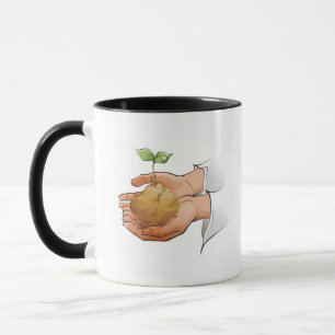 Close-up of a person's hands holding seedling mug