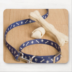 Close-up of a pet collar and a leash with dog mouse pad