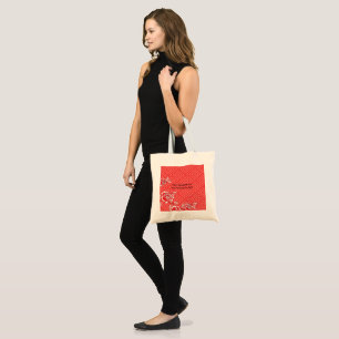 Close-up of a red and black patterned fabric, fe tote bag