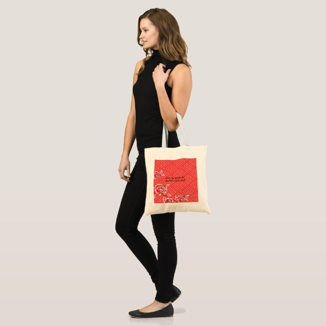 Close-up of a red and black patterned fabric, fe tote bag (Front (Model))