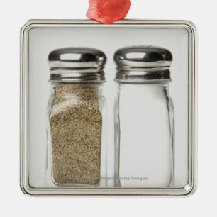 Close-up of a salt and a pepper shaker metal tree decoration