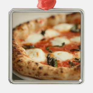 Close-up of a whole pizza pie metal tree decoration