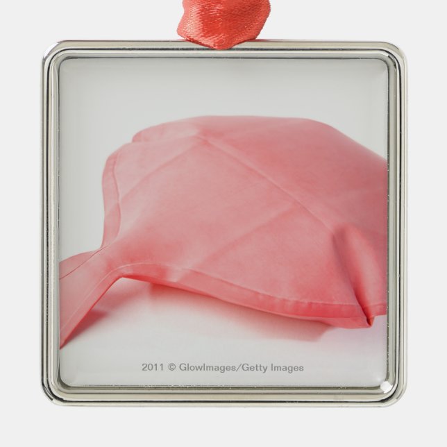 Close-up of a whoopee cushion metal ornament (Front)