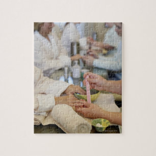 Close-up of a woman's hand getting a manicure jigsaw puzzle
