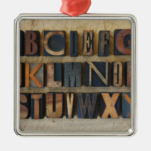 Close up of alphabet on letterpress metal tree decoration