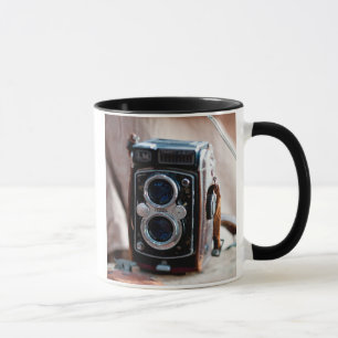 Close-up of an antique camera mug
