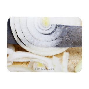 close-up of an onion, being cut into slices magnet