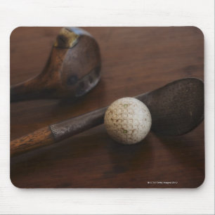 Close up of antique golf clubs and golf ball mouse pad