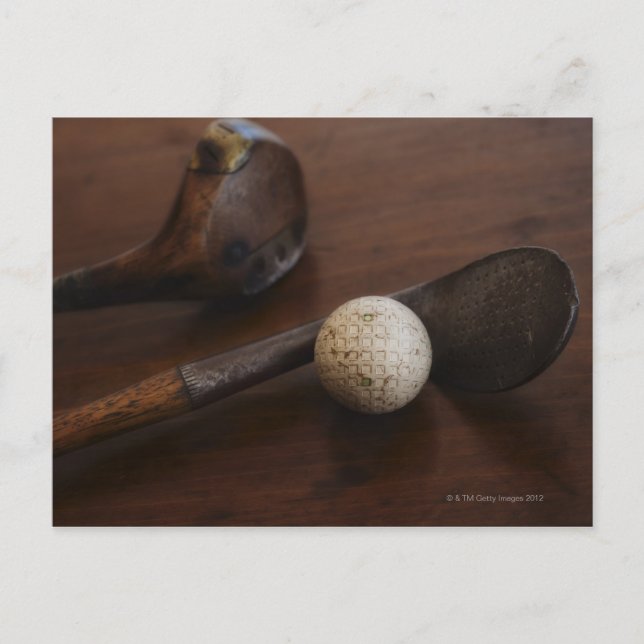 Close up of antique golf clubs and golf ball postcard (Front)