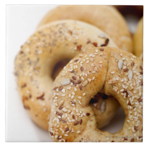 Close-up of assorted bagels on a plate ceramic tile