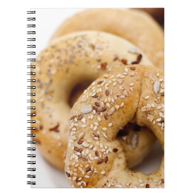 Close-up of assorted bagels on a plate notebook (Front)