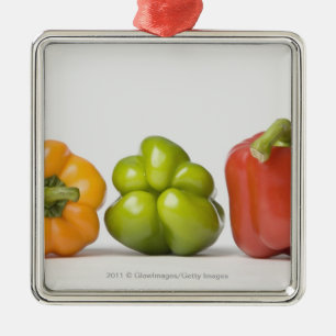 Close-up of bell peppers in a row metal tree decoration