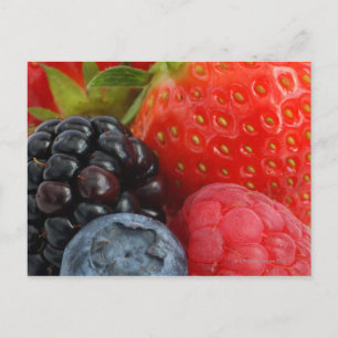 Close-up of blackberry, blueberry and postcard