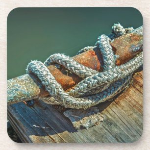 Close-up of boat cleat and rope coaster
