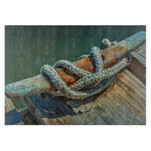 Close-up of boat cleat and rope cutting board