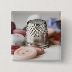 Close-up of buttons with a metal cap
