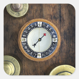 Close Up Of Chinese Compass And Gold Weights Square Sticker