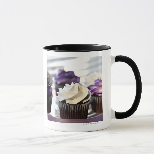 Close-up of cupcakes with selective focus on mug (Right)