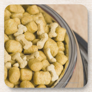 Close-up of dog food in a dog bowl coaster