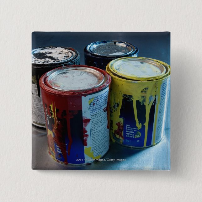 Close-up of four paint cans 15 cm square badge (Front)
