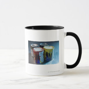 Close-up of four paint cans mug