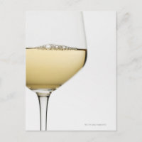 Close up of glass of white wine on white