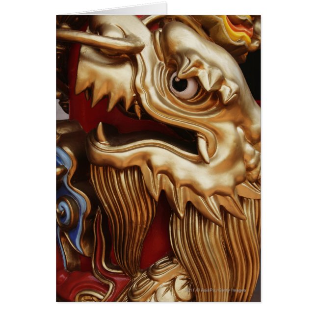 Close up of gold dragon on temple pillar (Front)