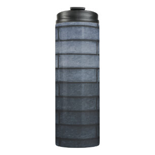 Close-up of gray brick wall thermal tumbler