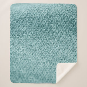Close up of green knitted textured background. sherpa blanket