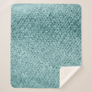 Close up of green knitted textured background. sherpa blanket