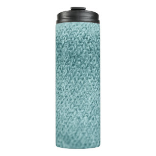 Close up of green knitted textured background. thermal tumbler