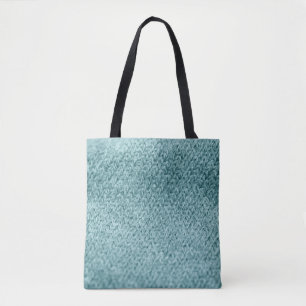 Close up of green knitted textured background.  tote bag
