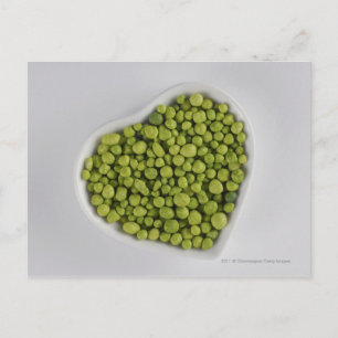 Close-up of green pebbles in a heart shape bowl postcard