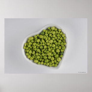 Close-up of green pebbles in a heart shape bowl poster