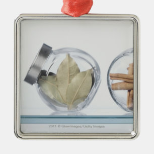 Close-up of herbs in two jars metal ornament