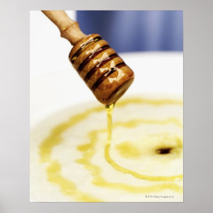 Close-up of honey dribbling on a dessert poster