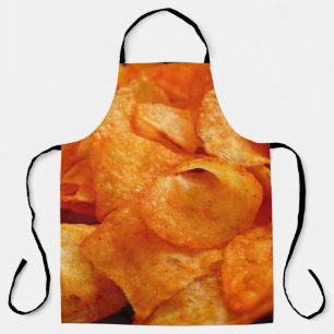 Close up of juicy, crispy, chips on black plate. apron