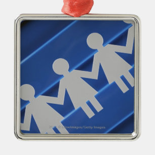 Close-up of paper chain dolls metal ornament