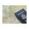 Close-up of passport lying on European map